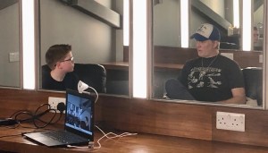 A behind the scenes photo of Logan and Josh Homme during their interview on Logan Sounds Off. 